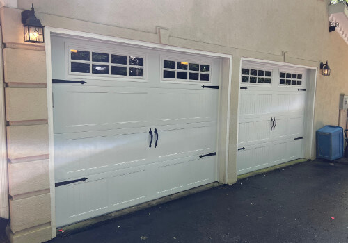 Newly Replaced, traditional-style garage doors on nice home